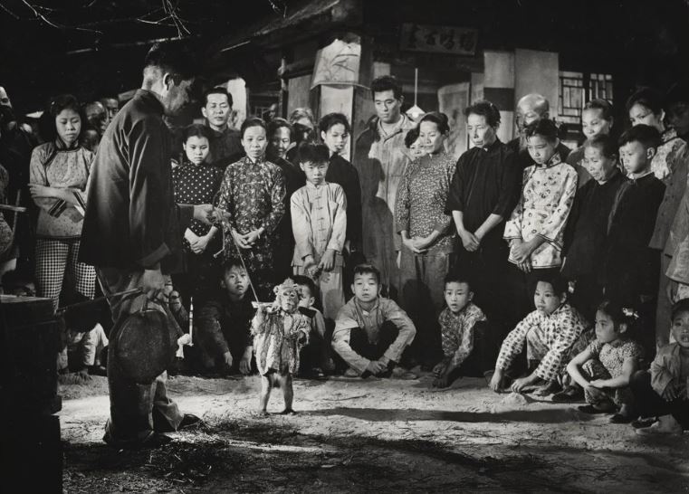 A man and his monkey perform (1964) | Photographer: Chung Man Lurk